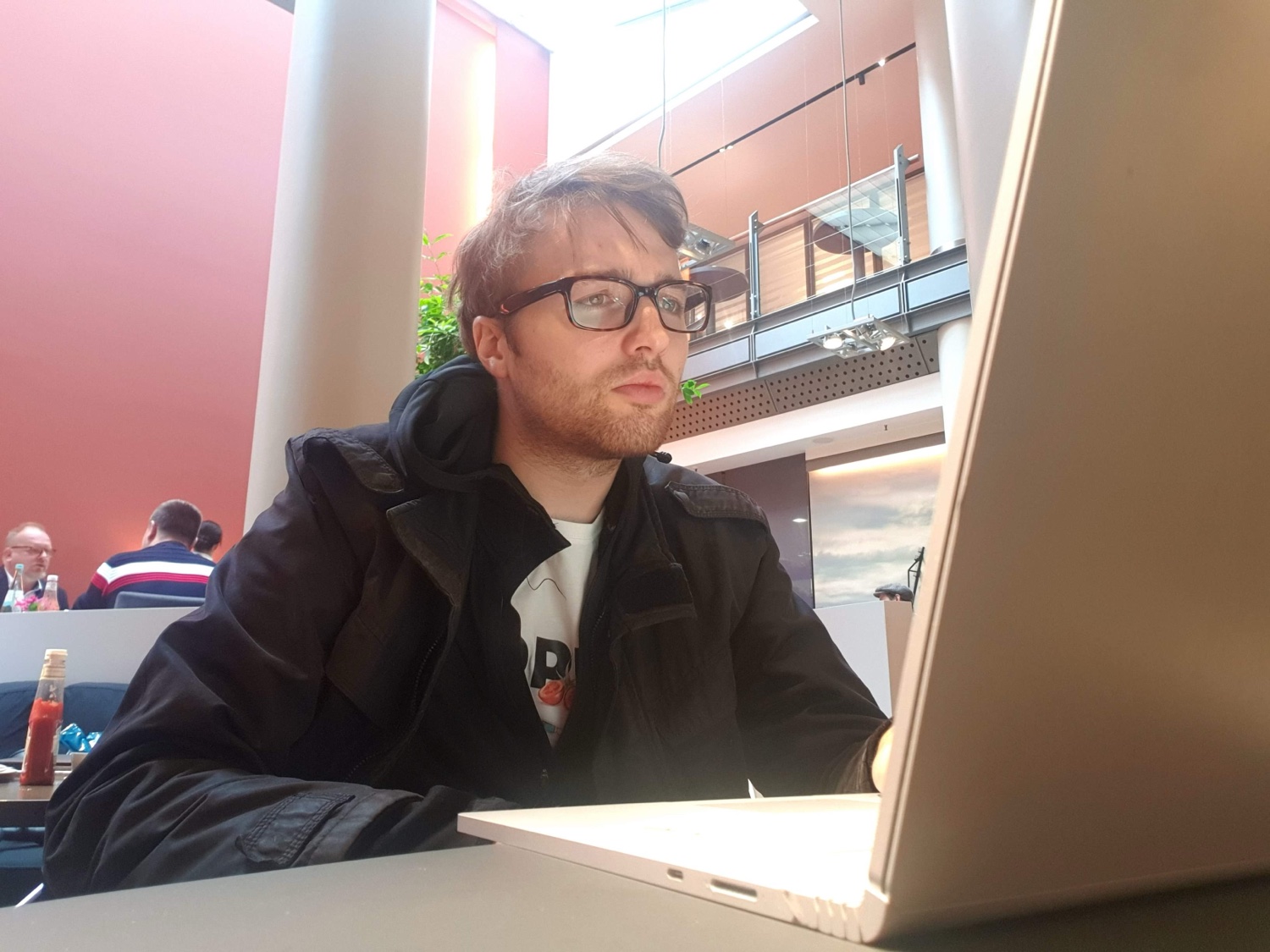 Simon Ruane working on a laptop